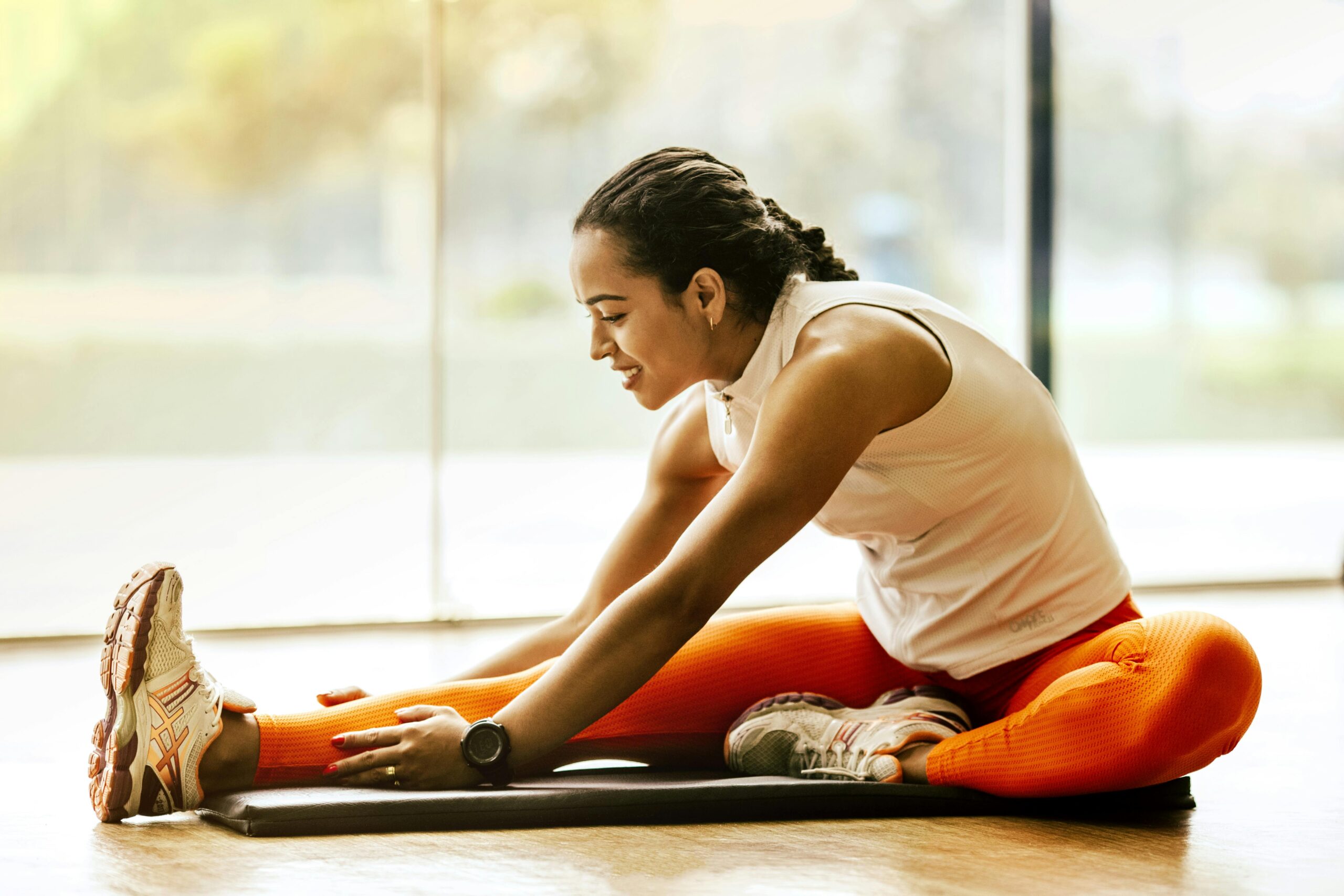 Photo by Jonathan Borba: https://www.pexels.com/photo/woman-stretching-on-ground-3076509/