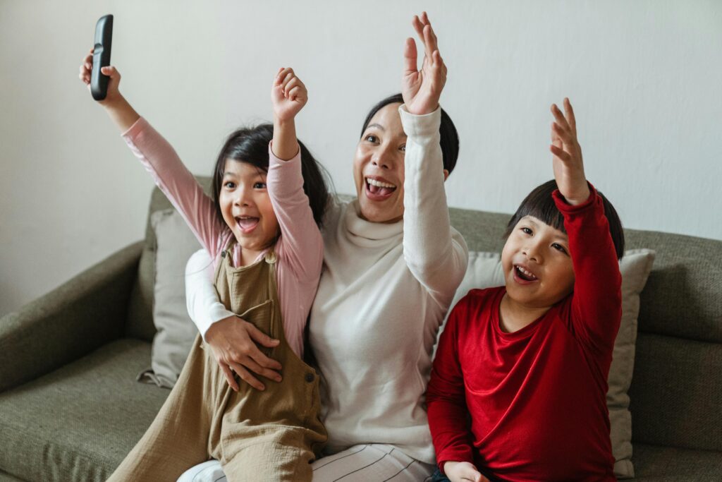 Photo by Ketut Subiyanto: https://www.pexels.com/photo/positive-ethnic-mother-with-children-watching-football-on-tv-and-celebrating-goal-4474017/